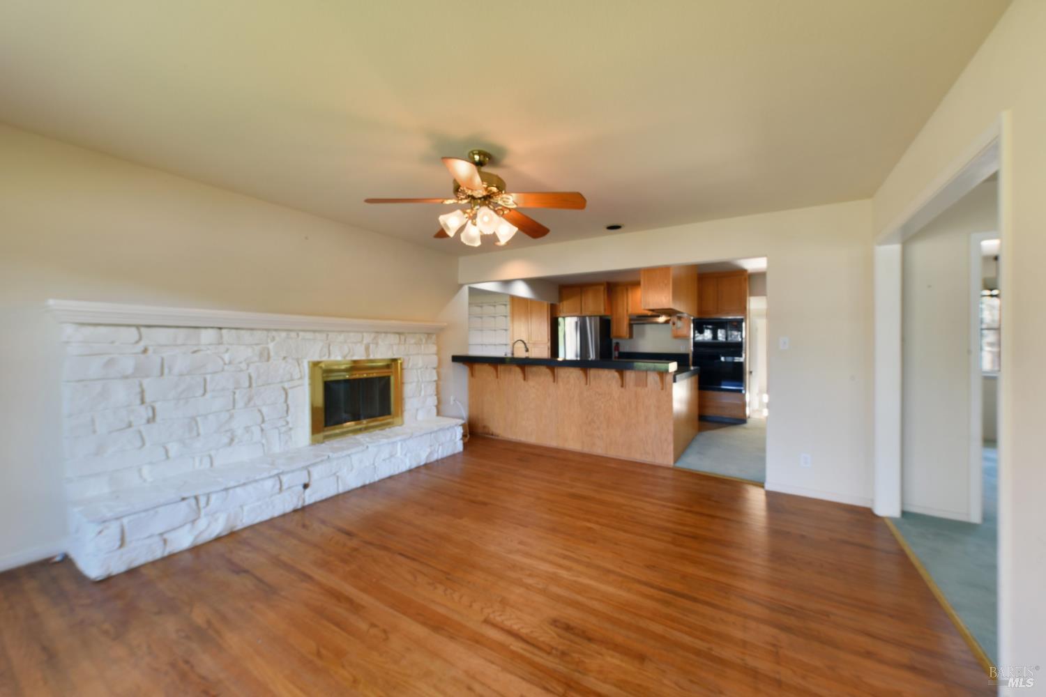 135 Fulton Place Windsor, CA 95492 - Photo 19 of 41 a view of a kitchen with a sink a microwave and a refrigerator