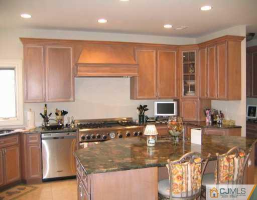 3 Skytop Road Edison, NJ 08820 - Photo 3 of 8 a kitchen with stainless steel appliances granite countertop a sink a stove and a cabinets