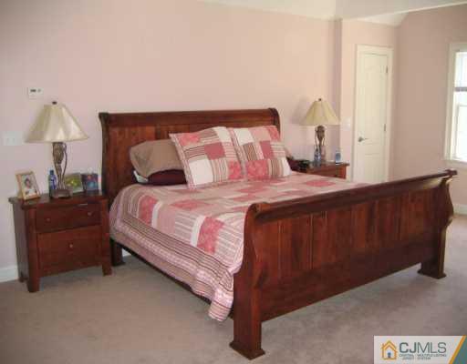 3 Skytop Road Edison, NJ 08820 - Photo 7 of 8 a bedroom with a bed and window