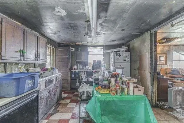 a kitchen with lots of counter top space and wooden floor