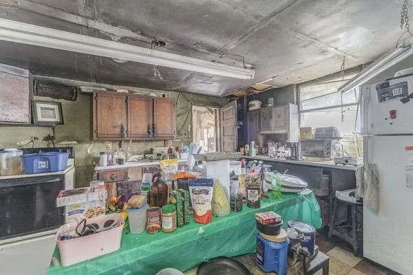 a room with lots of furniture and clutter