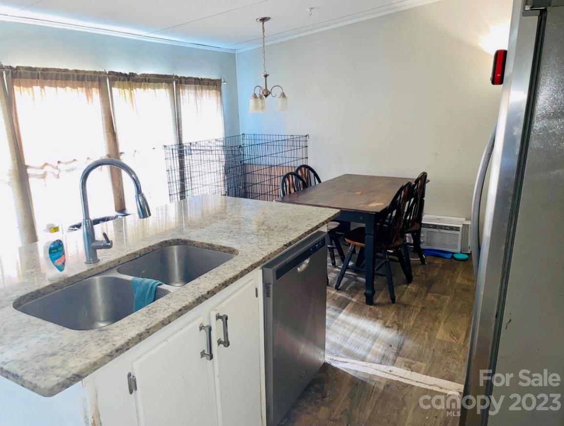 942 Stone Throw Drive Concord, NC 28025 - Photo 3 of 9 a kitchen with a table chairs and a counter top space