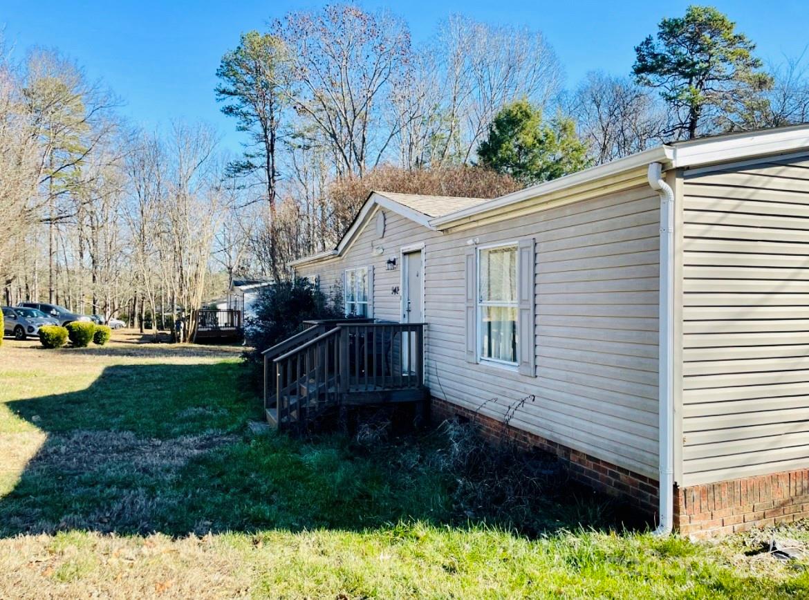942 Stone Throw Drive Concord, NC 28025 - Photo 7 of 9 a view of house with backyard and garden