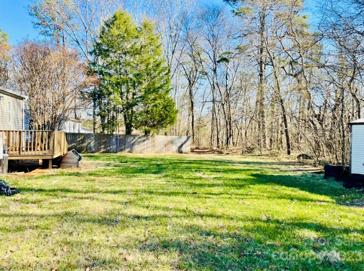 942 Stone Throw Drive Concord, NC 28025 - Photo 8 of 9 a view of swimming pool with a yard