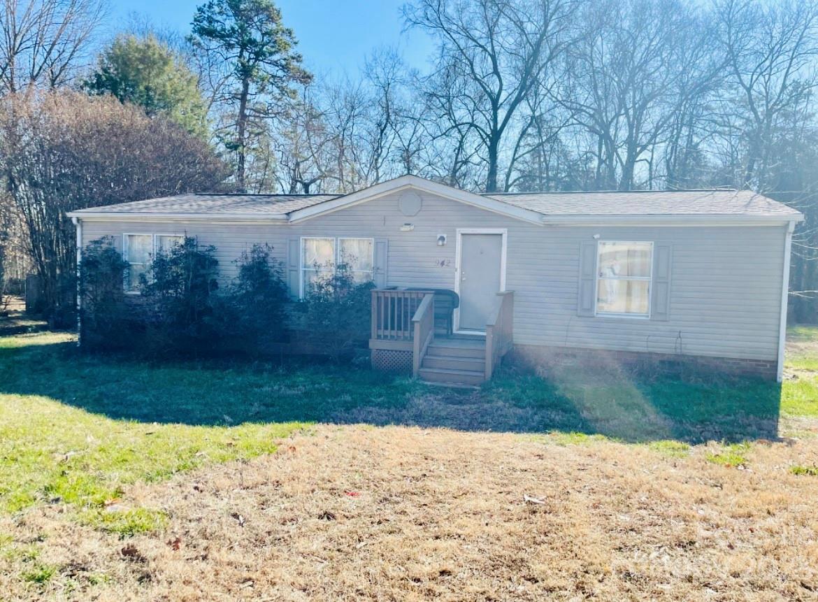 942 Stone Throw Drive Concord, NC 28025 - Photo 9 of 9 a front view of a house with a yard