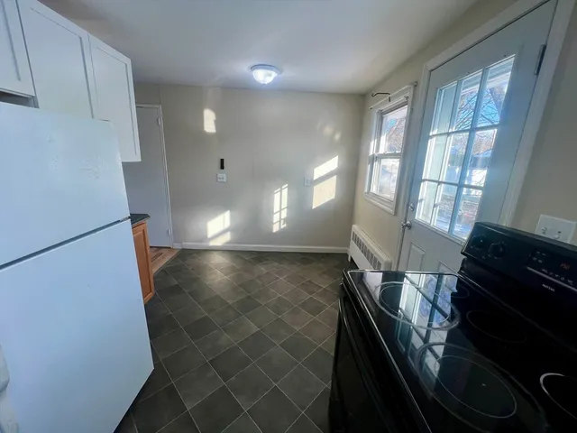 a view of a hallway with windows