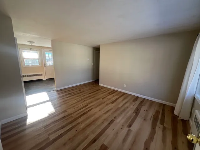 a view of an empty room and window