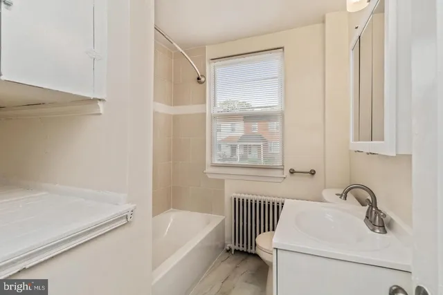 a bathroom with a sink and a bathtub