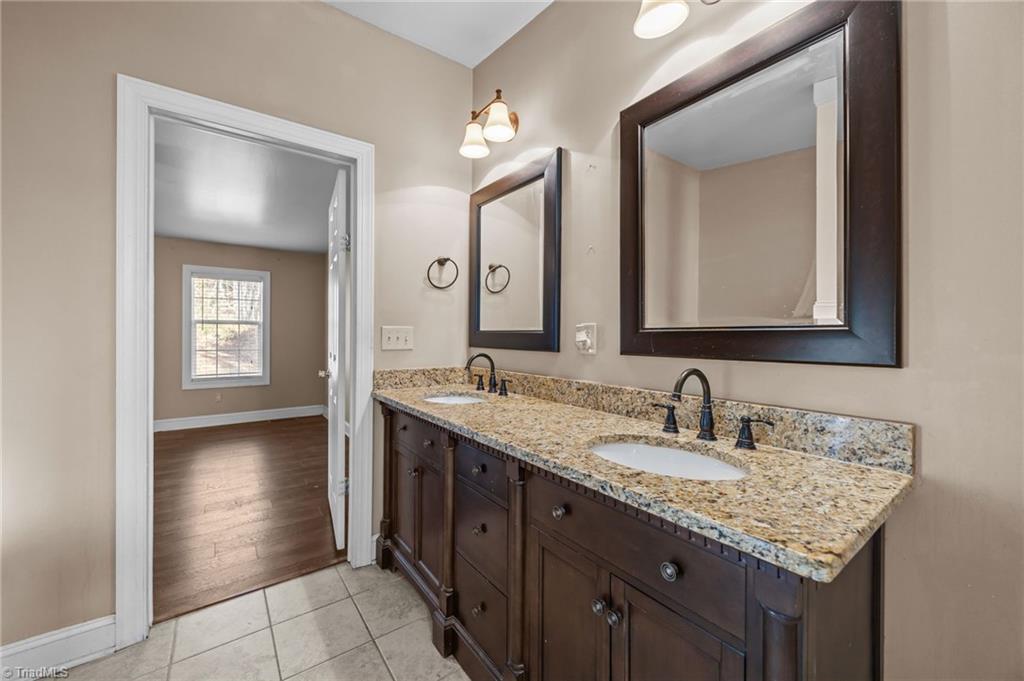 950 Waggoner Neal Road Walkertown, NC 27051 - Photo 27 of 48 Primary Bath with tile flooring and granite countertops