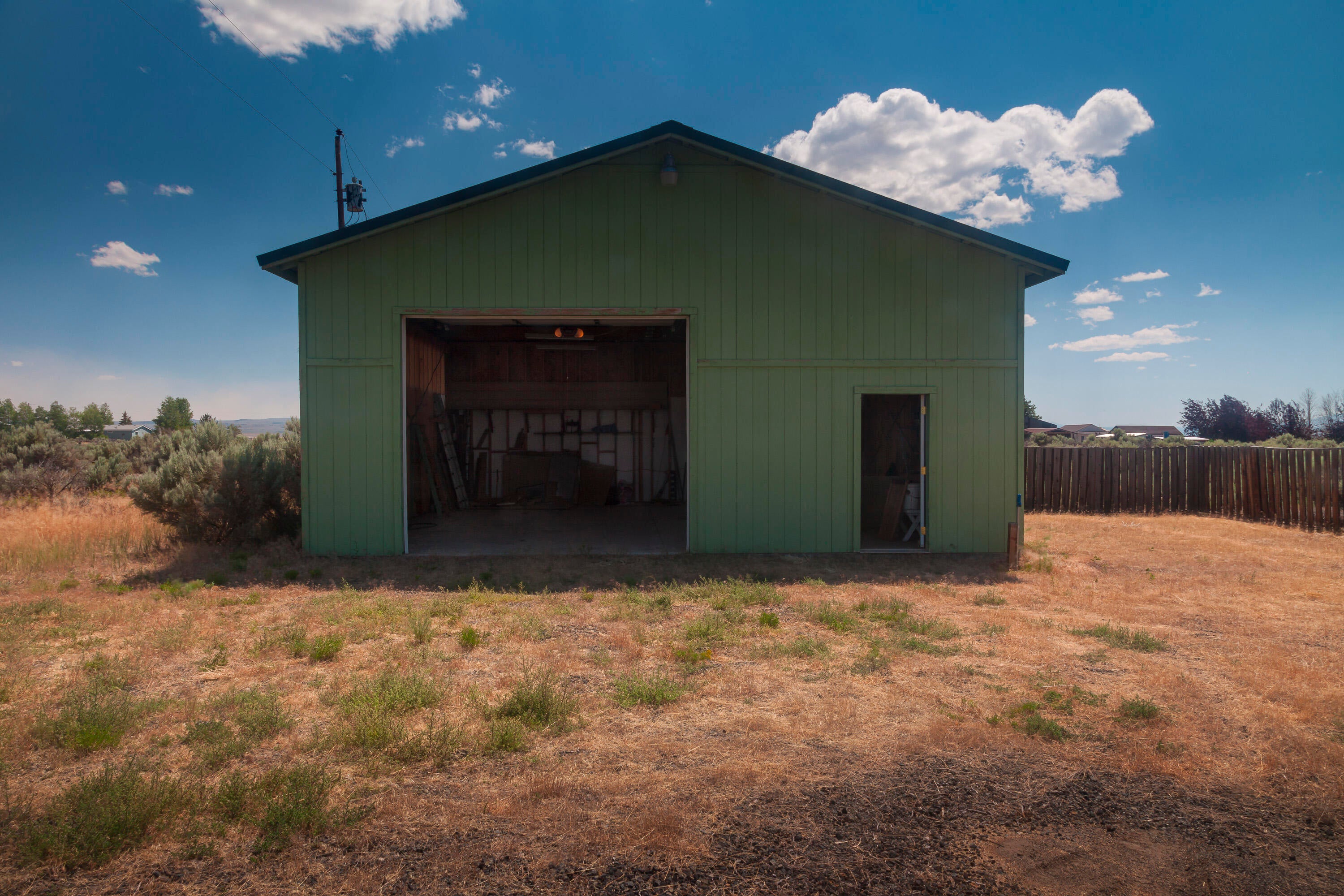 57282 Tinsel Road Christmas Valley, OR 97641 - Photo 45 of 54 North fa?ade of the home (doors open).