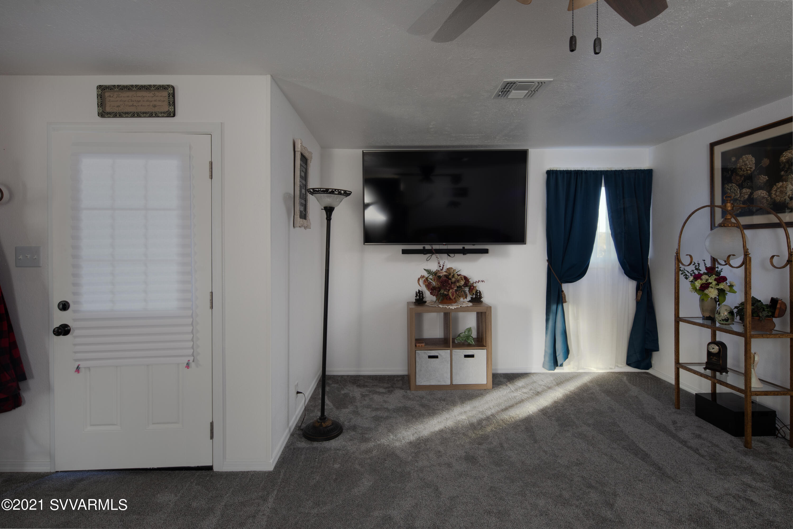 5501 North Dave Wingfield Road Rimrock, AZ 86335 - Photo 10 of 22 a view of a livingroom with furniture and a flat screen tv
