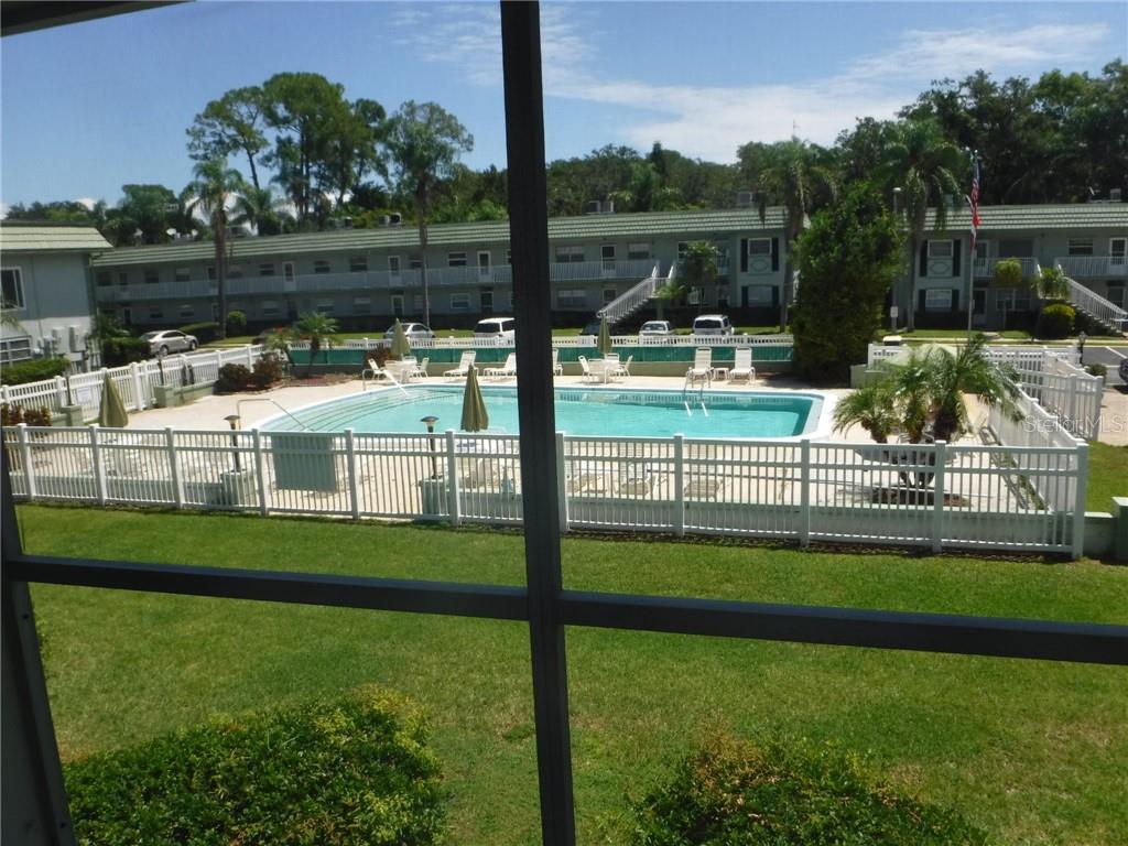 1433 South Belcher Road, Unit A11 Clearwater, FL 33764 - Photo 1 of 1 LOVELY POOL VIEW FROM CONDO