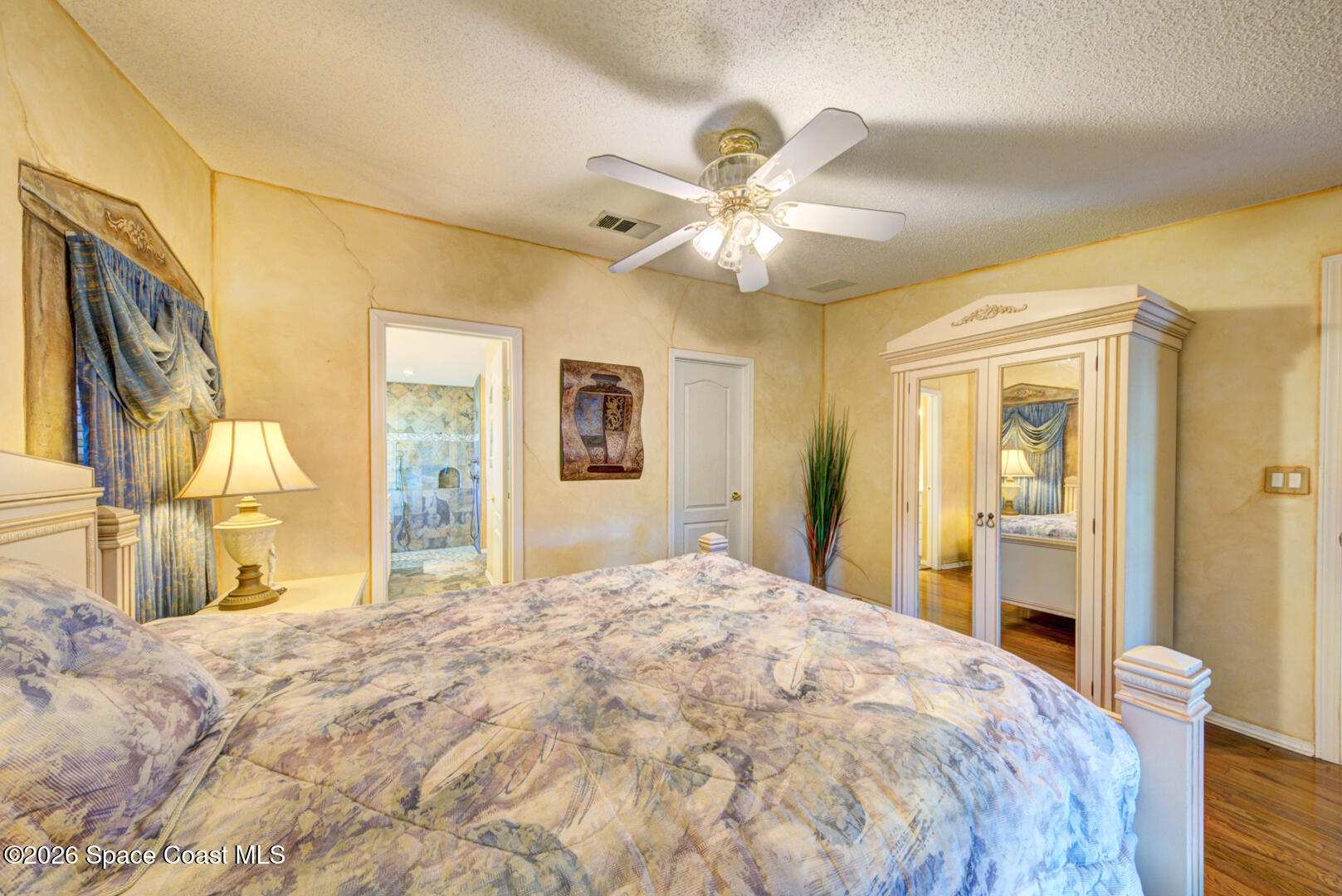 176 Woodsmill Boulevard, Unit 177 Cocoa, FL 32926 - Photo 17 of 63 15 primary bedroom with ensuite