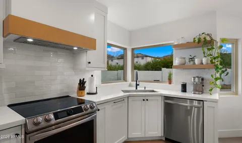 a kitchen with a sink cabinets and appliances