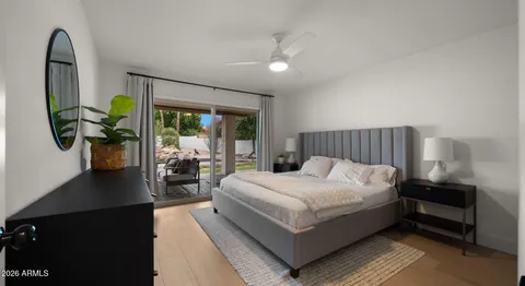 a bedroom with a bed and a dresser