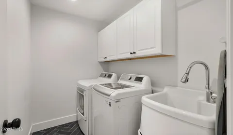 a bathroom with a sink a vanity and shower