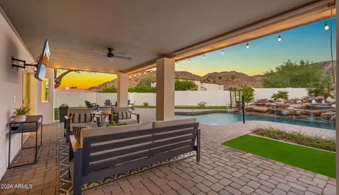 a view of a lake with lawn chairs