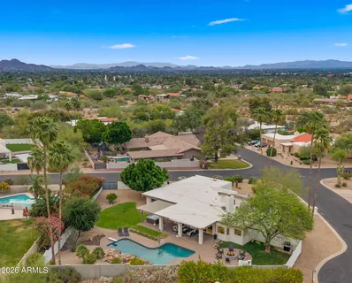 an aerial view of residential houses and outdoor space