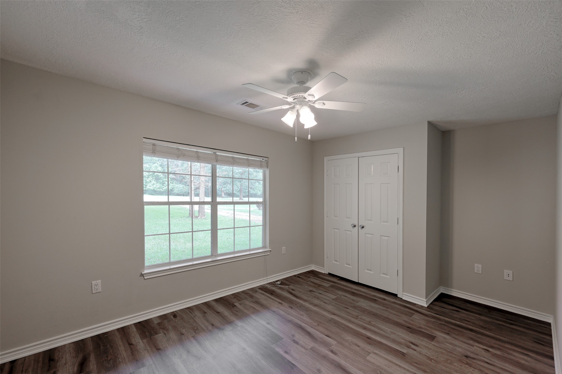 3131 Sapp Road Conroe, TX 77304 - Photo 26 of 48 wooden floor in an empty room with a window