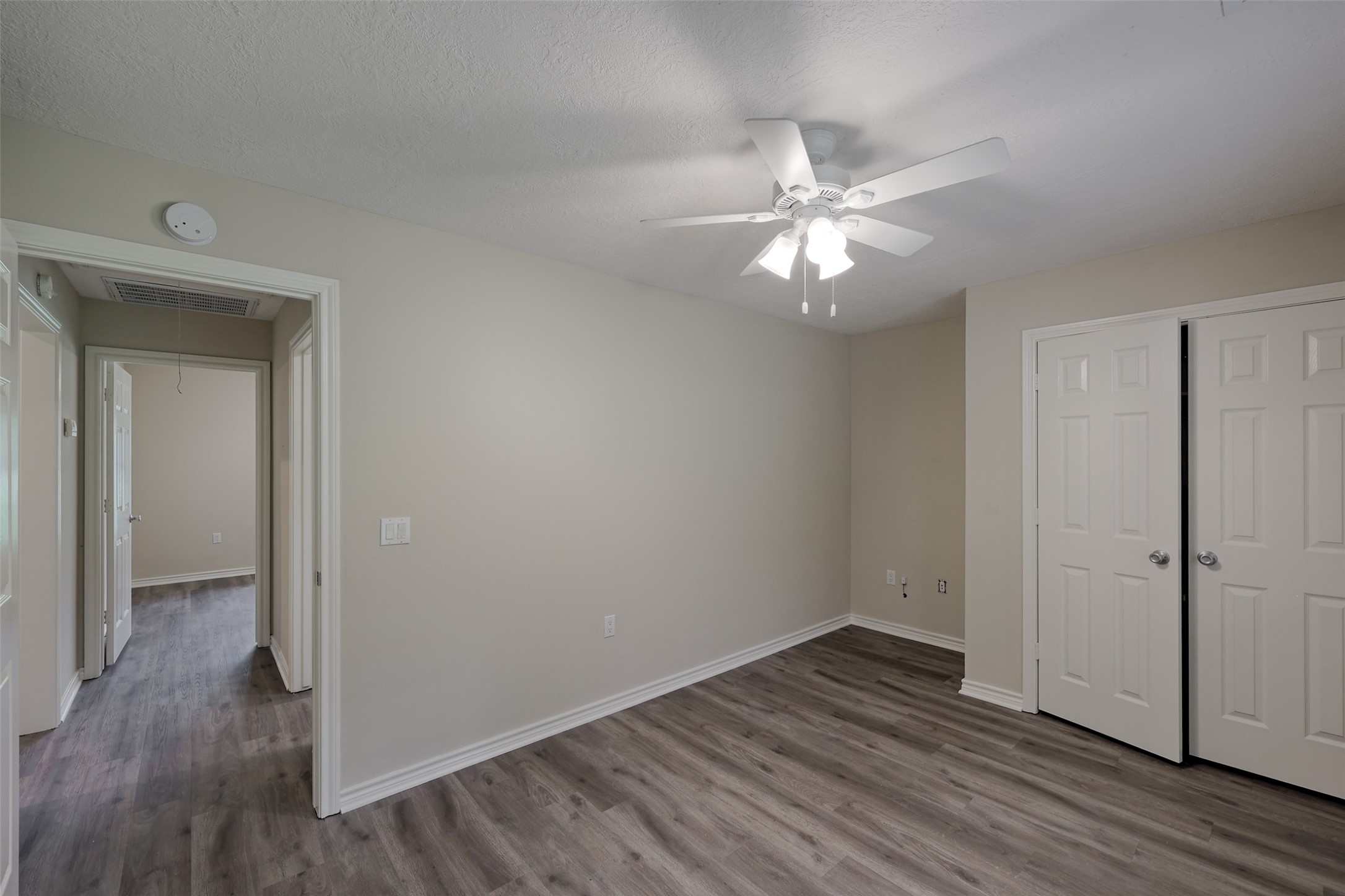 3131 Sapp Road Conroe, TX 77304 - Photo 27 of 48 a view of an empty room with wooden floor