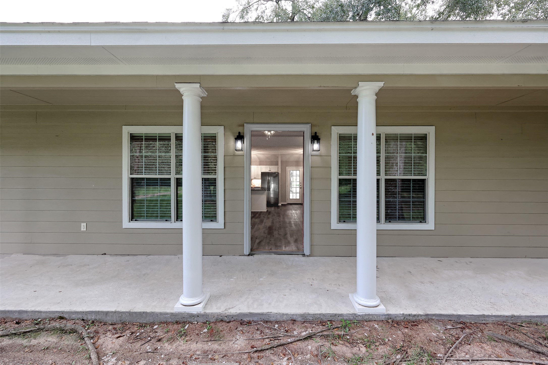 3131 Sapp Road Conroe, TX 77304 - Photo 8 of 48 a view of a hallway with wooden floor and a window