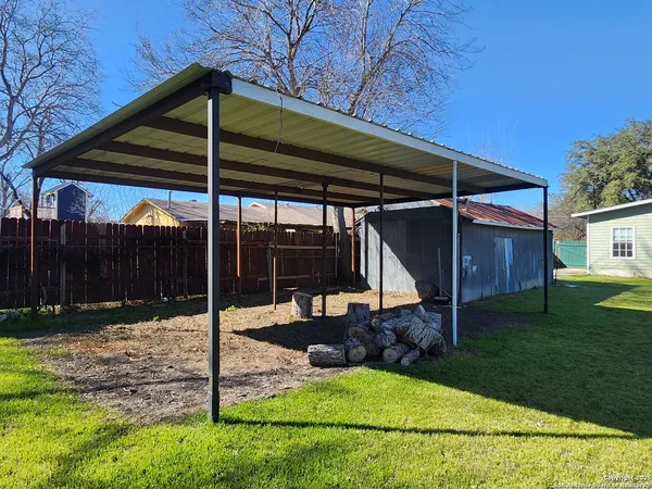 a view of backyard with green space