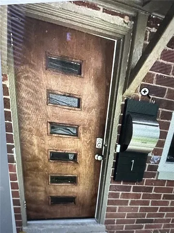 a bathroom with a shower and a mirror