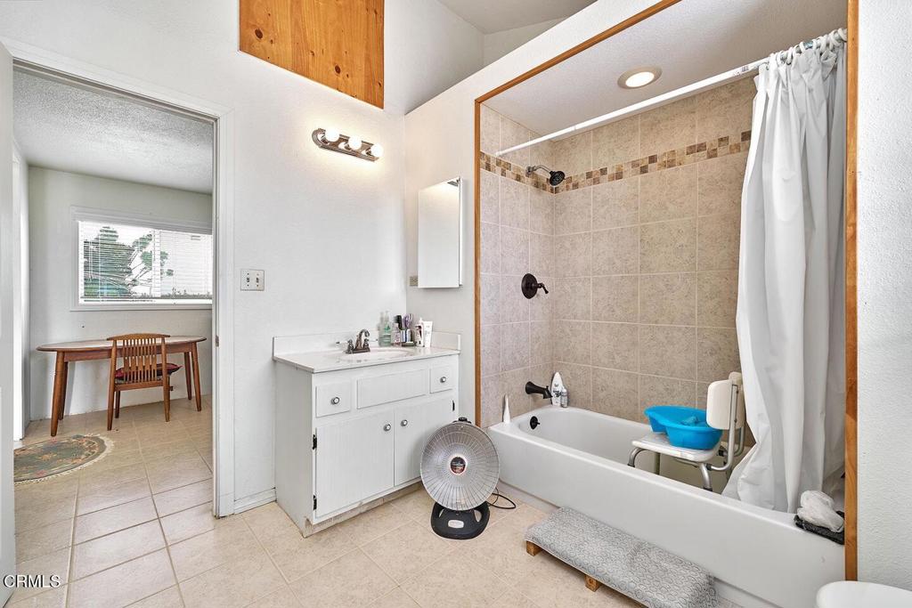 9494 Baker Road Lucerne Valley, CA 92356 - Photo 11 of 56 a bathroom with a bathtub sink and a shower