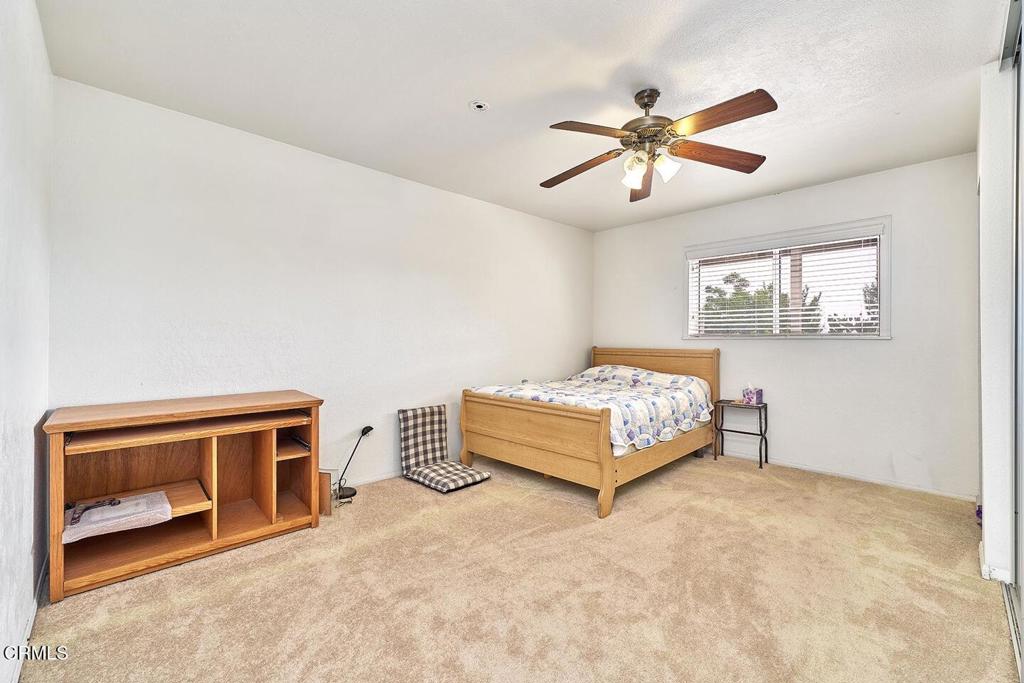 9494 Baker Road Lucerne Valley, CA 92356 - Photo 23 of 56 a bedroom with furniture and window