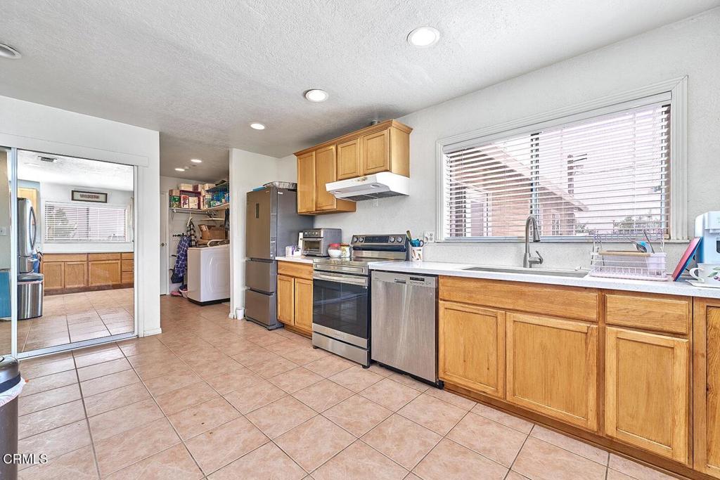 9494 Baker Road Lucerne Valley, CA 92356 - Photo 33 of 56 a kitchen with a sink and cabinets