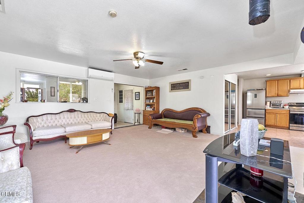 9494 Baker Road Lucerne Valley, CA 92356 - Photo 41 of 56 a bedroom with furniture and a chandelier