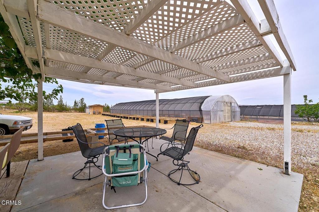 9494 Baker Road Lucerne Valley, CA 92356 - Photo 51 of 56 a view of a chairs and table in patio