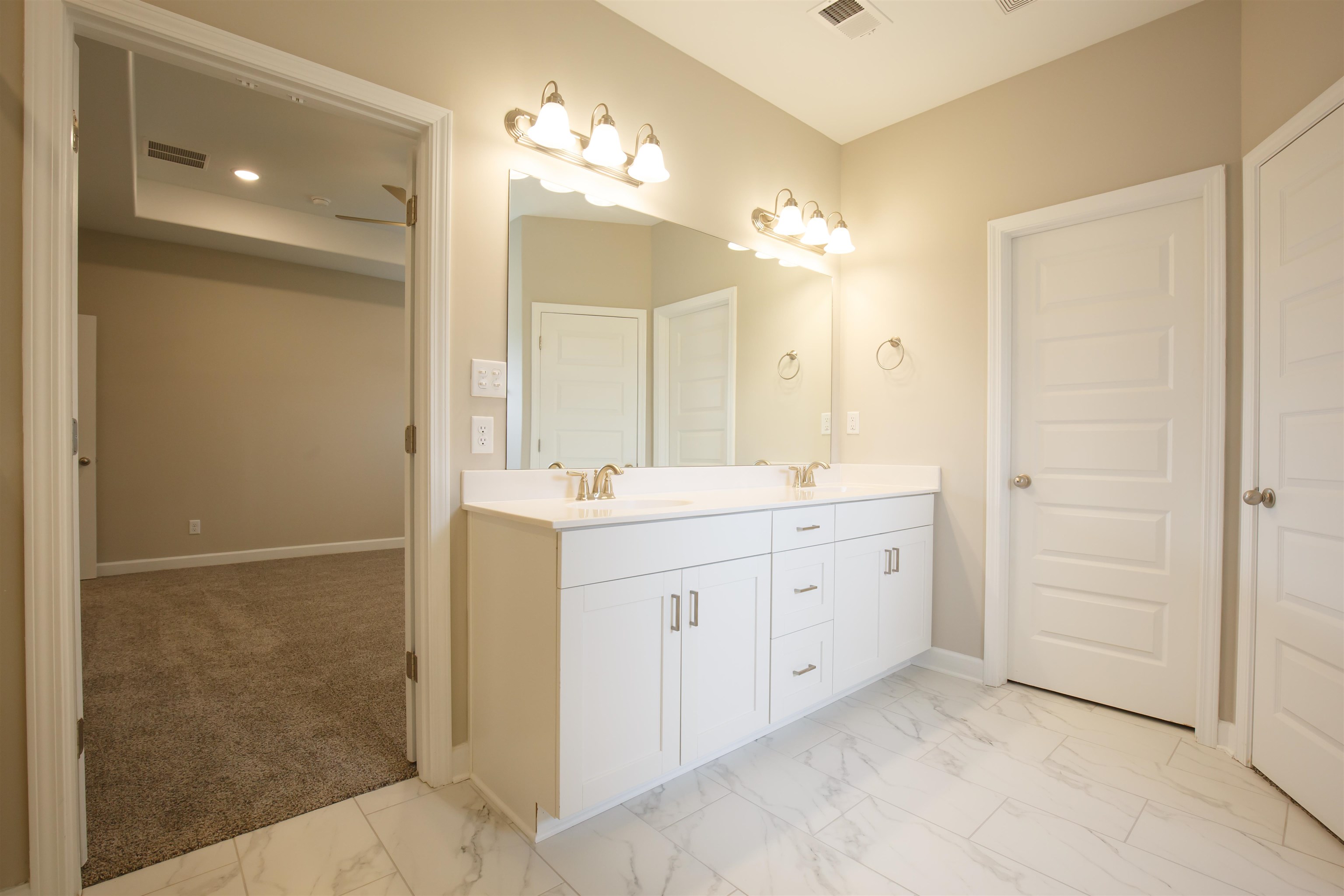 8763 Shipp Road Millington, TN 38053 - Photo 7 of 9 Full bath with marble finish floor, baseboards, a sink, and visible vents