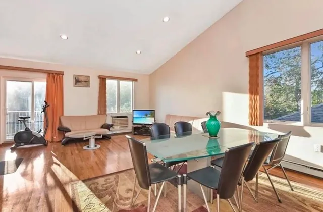 a view of a dining room with furniture window and outside view