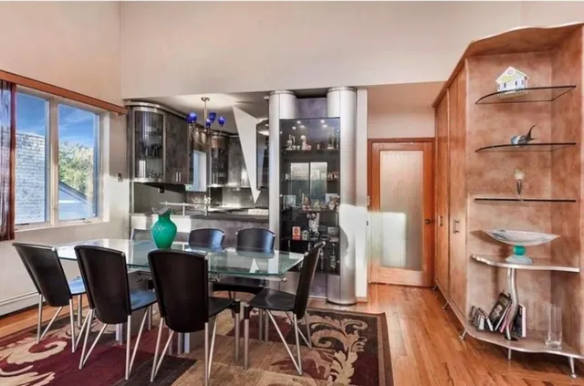 a view of a dining room with furniture window and outside view