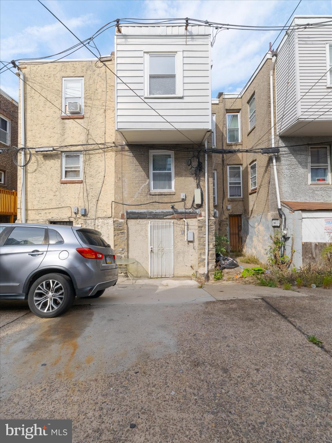 5428 Belmar Street Philadelphia, PA 19143 - Photo 25 of 25 a front view of a house with parking space