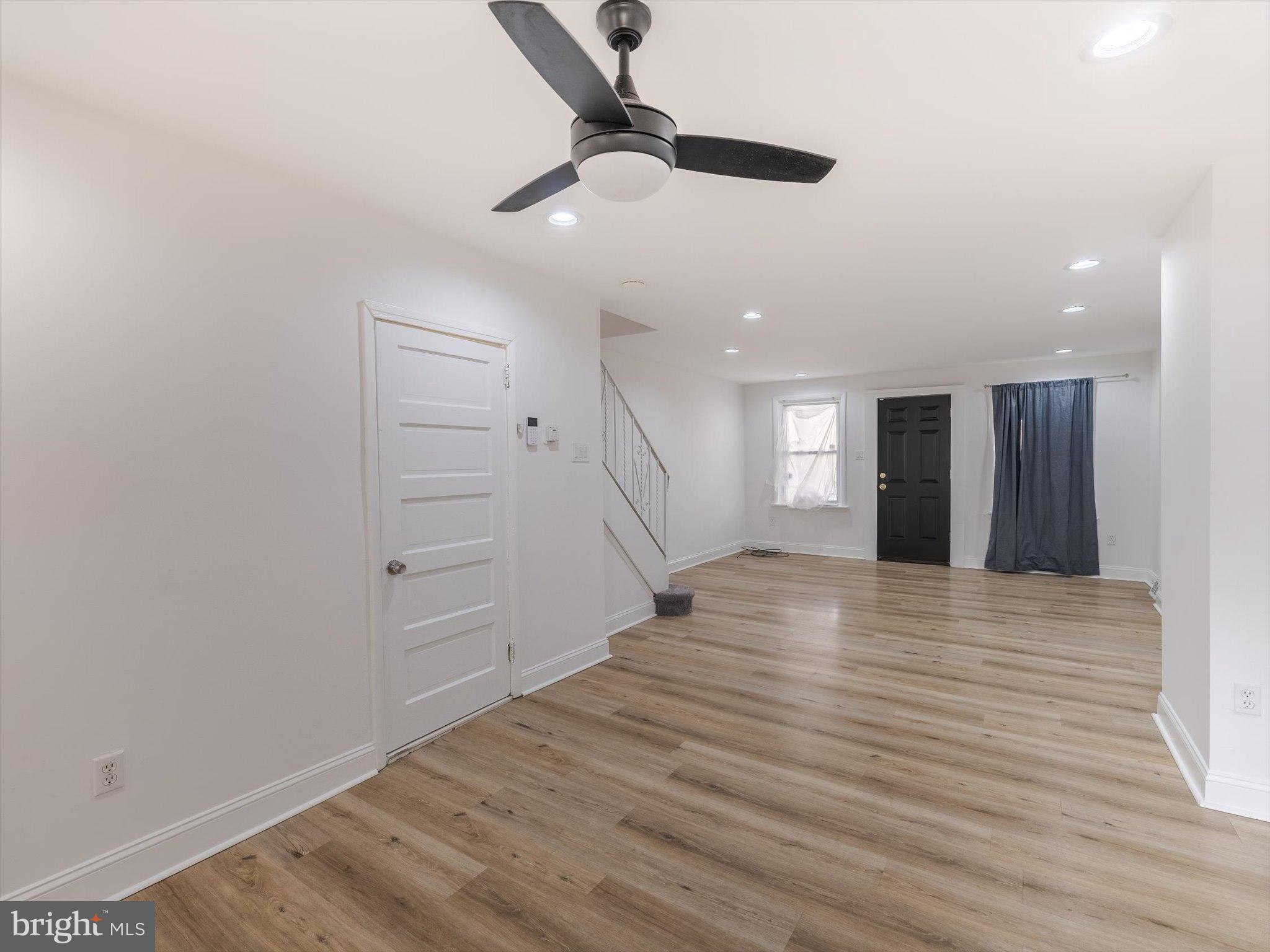 5428 Belmar Street Philadelphia, PA 19143 - Photo 5 of 25 a view of an empty room with window and wooden floor