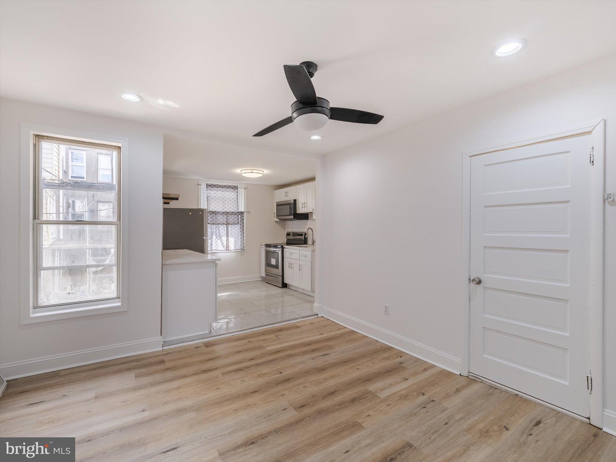 5428 Belmar Street Philadelphia, PA 19143 - Photo 7 of 25 a view of a kitchen with a sink and a window