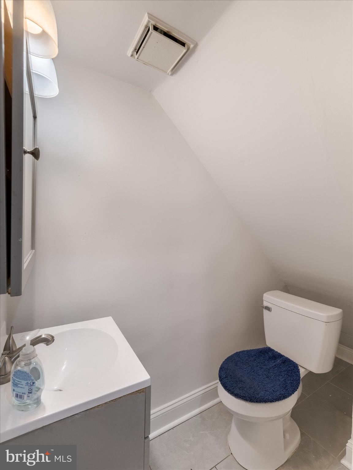 5428 Belmar Street Philadelphia, PA 19143 - Photo 10 of 25 a bathroom with a toilet and a sink