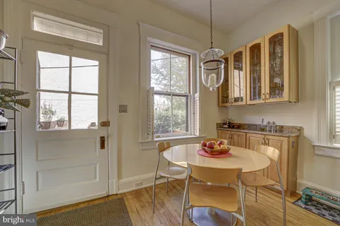 a kitchen with a table and chairs in it