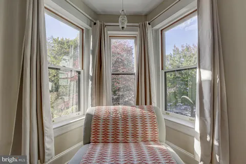 a bathroom with a sink a mirror and a shower