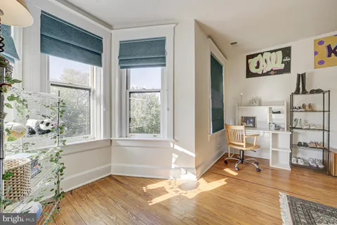a bedroom with furniture and a window
