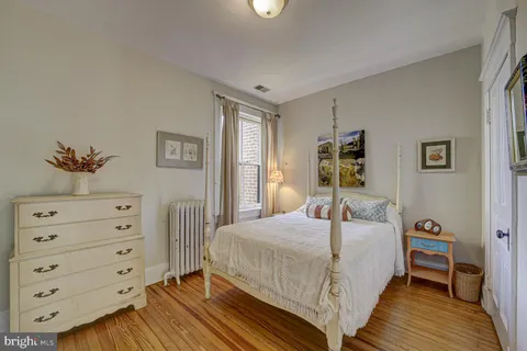 a bathroom with a double vanity sink mirror and a window