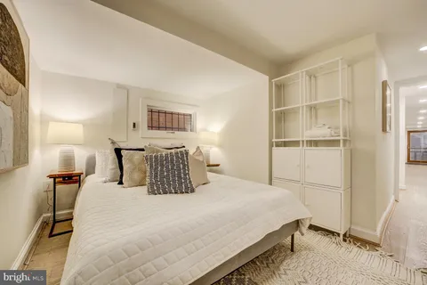 a dining room with a wooden table and chairs