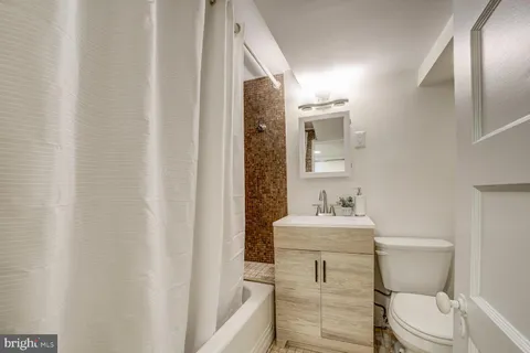 a view of a patio with iron fence