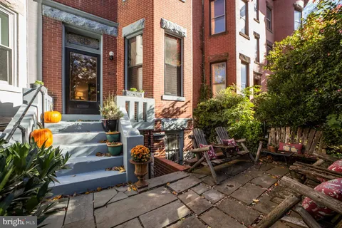 a view of a swimming pool with a outdoor seating