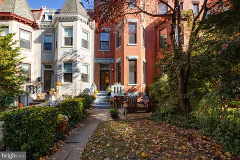a room with wooden floor and furniture