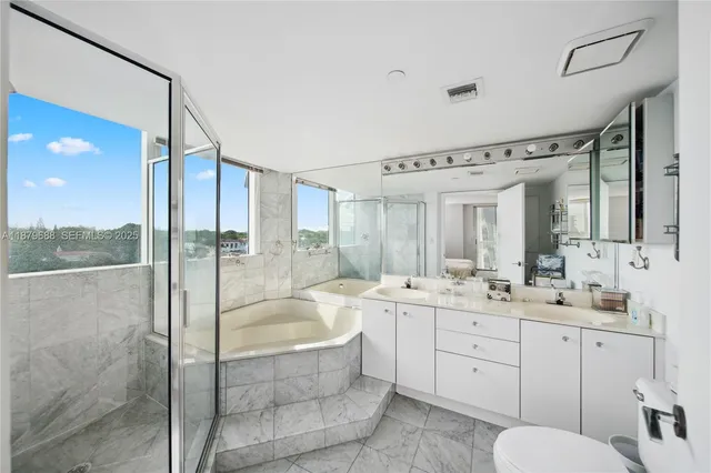 a bed sitting in a room next to a window