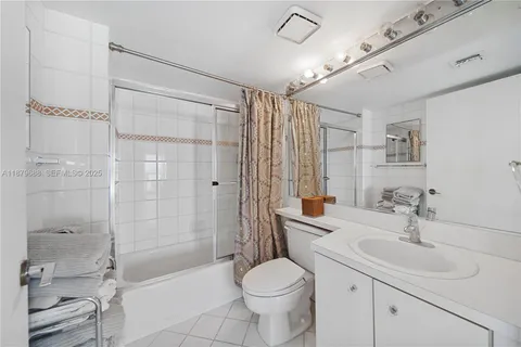 a kitchen with a refrigerator and table