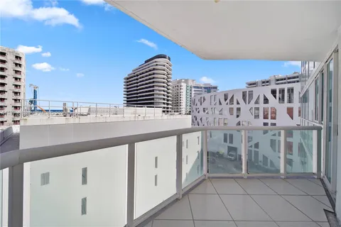 a view of balcony with wooden floor